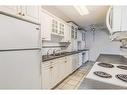 206-5330 47 Avenue, Red Deer, AB  - Indoor Photo Showing Kitchen With Double Sink 
