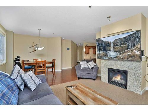 105-4707 50 Street, Sylvan Lake, AB - Indoor Photo Showing Living Room With Fireplace