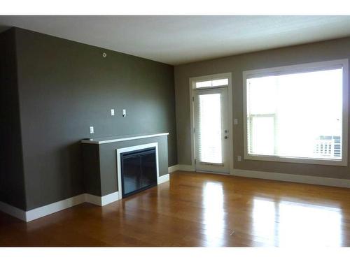 402-5901 71 Ave, Rocky Mountain House, AB - Indoor With Fireplace