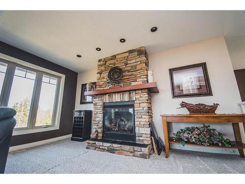 524 Summer Crescent, Rural Ponoka County, AB - Indoor Photo Showing Living Room With Fireplace