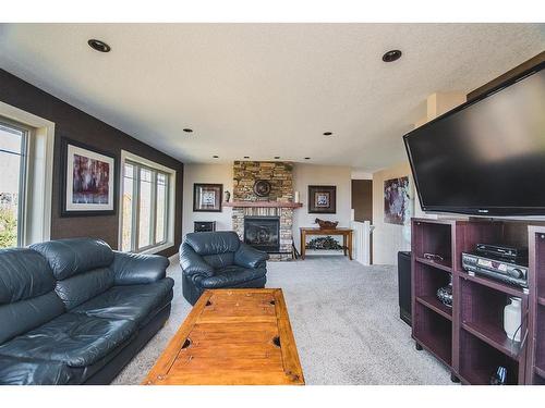524 Summer Crescent, Rural Ponoka County, AB - Indoor Photo Showing Living Room With Fireplace