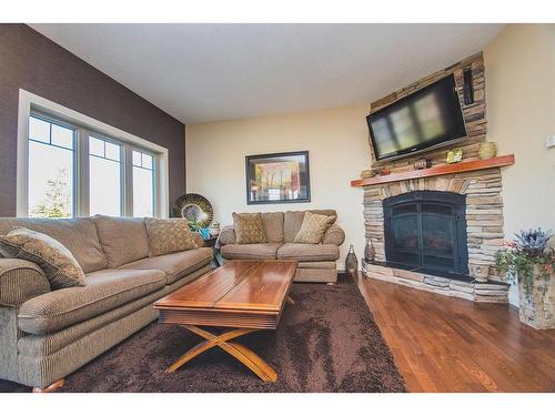 524 Summer Crescent, Rural Ponoka County, AB - Indoor Photo Showing Living Room With Fireplace