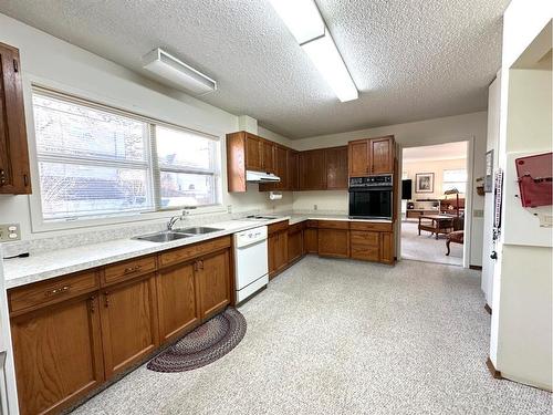 4709 51 Street, Camrose, AB - Indoor Photo Showing Kitchen With Double Sink