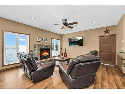 433002 Range Road 24, Rural Ponoka County, AB - Indoor Photo Showing Living Room With Fireplace