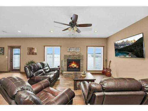 433002 Range Road 24, Rural Ponoka County, AB - Indoor Photo Showing Living Room With Fireplace