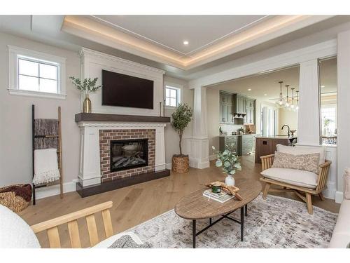 7 Songbird Green, Sylvan Lake, AB - Indoor Photo Showing Living Room With Fireplace