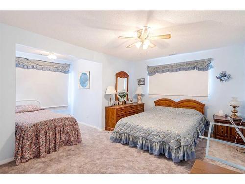 3 Rustic Road, Norglenwold, AB - Indoor Photo Showing Bedroom