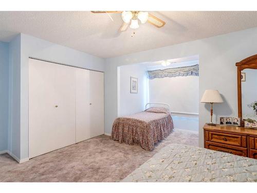 3 Rustic Road, Norglenwold, AB - Indoor Photo Showing Bedroom