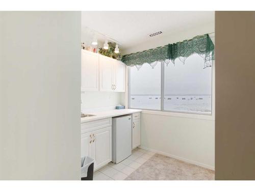 3 Rustic Road, Norglenwold, AB - Indoor Photo Showing Laundry Room