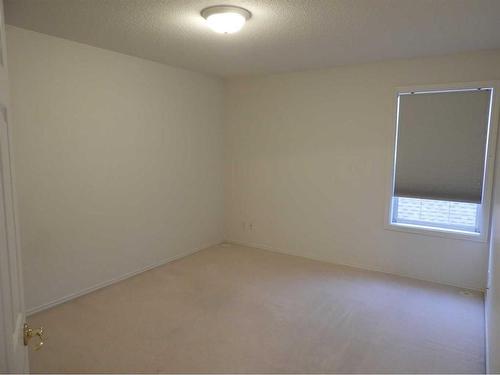 9-5034 53 Street, Lacombe, AB - Indoor Photo Showing Other Room