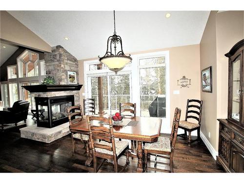405 Birchcliff Road, Birchcliff, AB - Indoor Photo Showing Dining Room With Fireplace