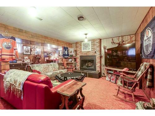 1156 Highway 11A, Sylvan Lake, AB - Indoor With Fireplace