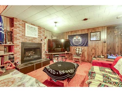 1156 Highway 11A, Sylvan Lake, AB - Indoor Photo Showing Living Room With Fireplace