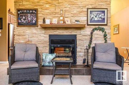 473061 A Rr 243A, Millet, AB - Indoor Photo Showing Living Room With Fireplace