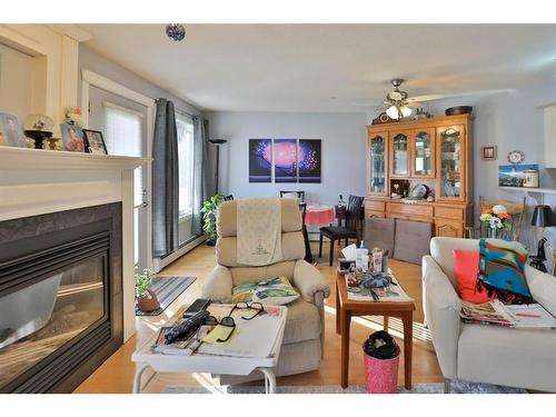204-5419 49 Avenue, Camrose, AB - Indoor Photo Showing Living Room With Fireplace