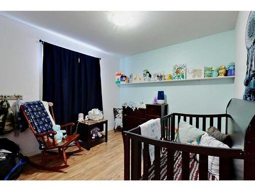 585 Red Cedar Place, Springbrook, AB - Indoor Photo Showing Bedroom