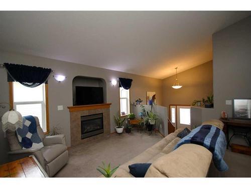 125 Ireland Crescent, Red Deer, AB - Indoor Photo Showing Living Room With Fireplace