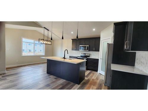 4761 Aspen Lakes Boulevard, Blackfalds, AB - Indoor Photo Showing Kitchen With Upgraded Kitchen