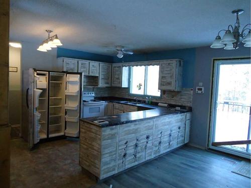 11 Parkland Way, Rural Ponoka County, AB - Indoor Photo Showing Kitchen With Double Sink