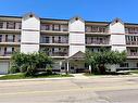 311-5020 49 Street, Rocky Mountain House, AB  - Outdoor With Balcony With Facade 