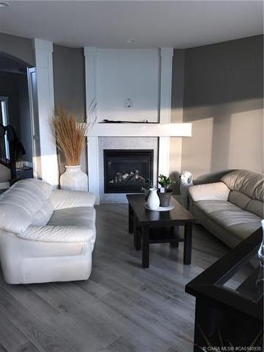 74 Lalor Drive, Red Deer, AB - Indoor Photo Showing Living Room With Fireplace