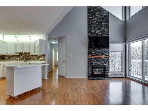 304-5435 Lakeshore Drive, Sylvan Lake, AB - Indoor Photo Showing Other Room With Fireplace