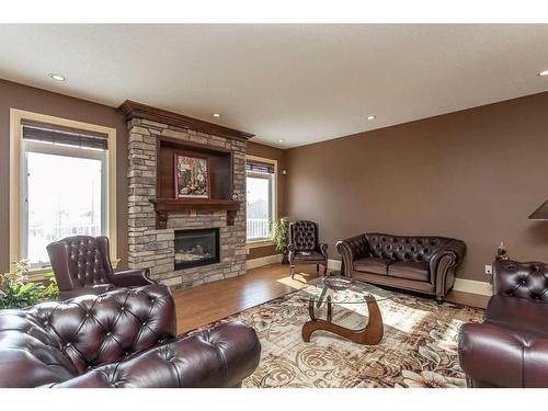 64 Cyprus Road, Blackfalds, AB - Indoor Photo Showing Living Room With Fireplace