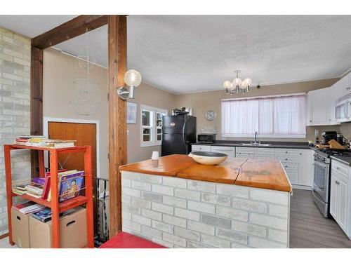 4624 48 Street, Sylvan Lake, AB - Indoor Photo Showing Kitchen With Double Sink