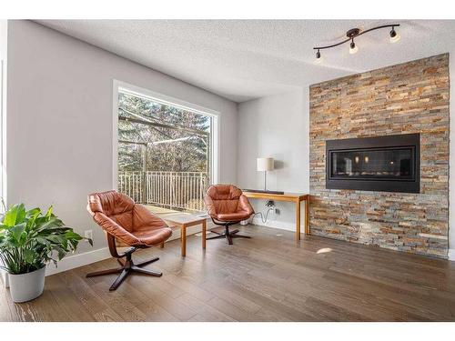 917 East Lakeview Road, Chestermere, AB - Indoor Photo Showing Living Room With Fireplace