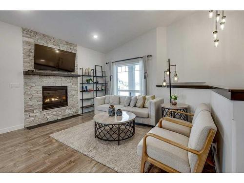 73 Longmire Close, Red Deer, AB - Indoor Photo Showing Living Room With Fireplace