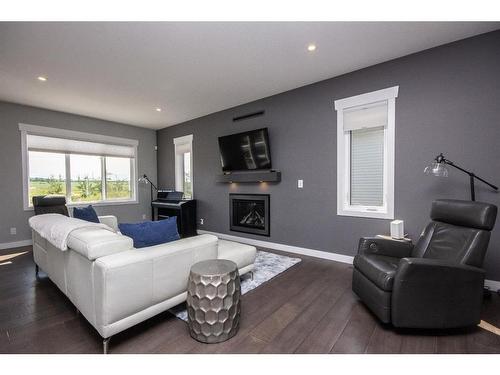 1 Toal Close, Red Deer, AB - Indoor Photo Showing Living Room With Fireplace