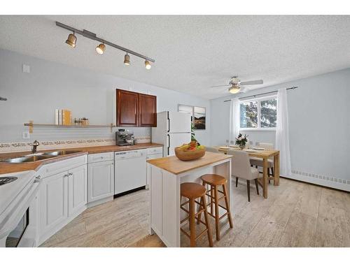 302-4415 48 Avenue, Red Deer, AB - Indoor Photo Showing Kitchen With Double Sink