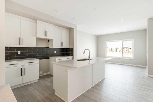 32 Linden Place, Rural Red Deer County, AB - Indoor Photo Showing Kitchen With Double Sink