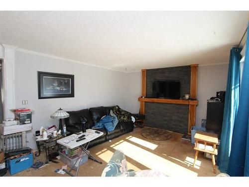 5112 51 Avenue, Caroline, AB - Indoor Photo Showing Living Room With Fireplace