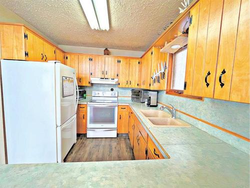 630 Cedar Way, Rural Camrose County, AB - Indoor Photo Showing Kitchen With Double Sink
