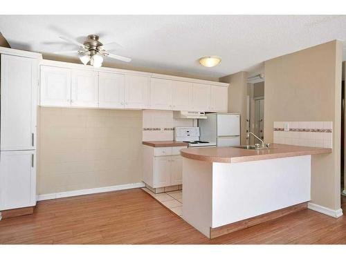 208-4700 55 Street, Red Deer, AB - Indoor Photo Showing Kitchen With Double Sink