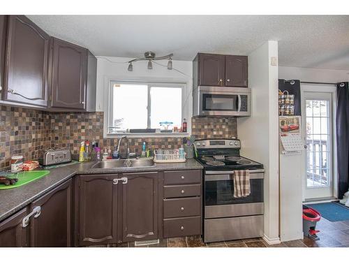 192 Cosgrove Crescent, Red Deer, AB - Indoor Photo Showing Kitchen With Double Sink