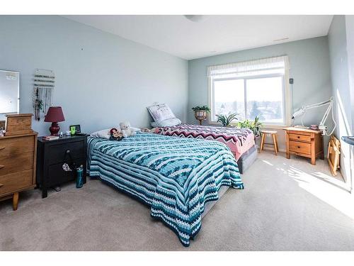 403-4425 Heritage Way, Lacombe, AB - Indoor Photo Showing Bedroom