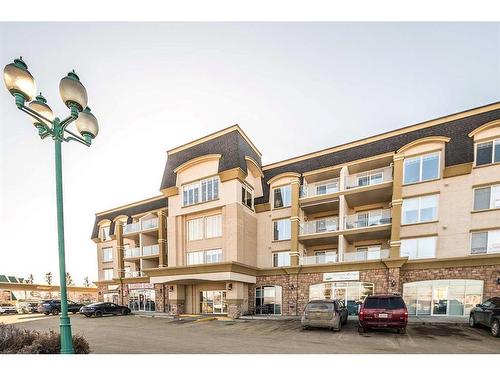 403-4425 Heritage Way, Lacombe, AB - Outdoor With Balcony With Facade