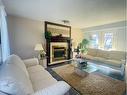 5909 60 Avenue, Ponoka, AB  - Indoor Photo Showing Living Room With Fireplace 