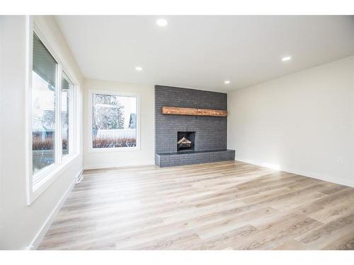 4310 Michener Drive South, Red Deer, AB - Indoor Photo Showing Other Room With Fireplace