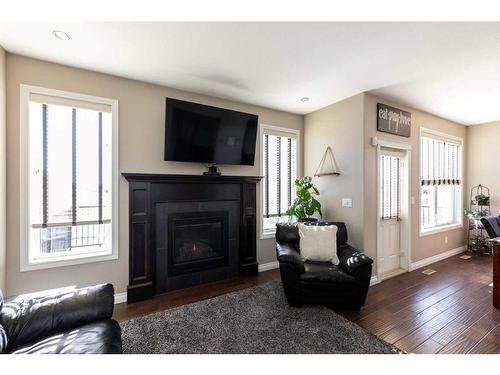 48 Cyprus Road, Blackfalds, AB - Indoor Photo Showing Living Room With Fireplace