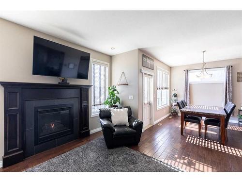 48 Cyprus Road, Blackfalds, AB - Indoor Photo Showing Living Room With Fireplace