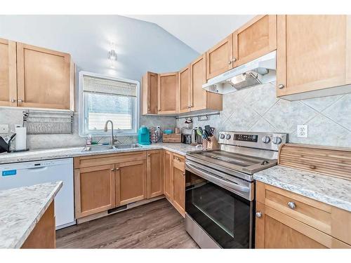 60 Wildrose Drive, Sylvan Lake, AB - Indoor Photo Showing Kitchen With Double Sink