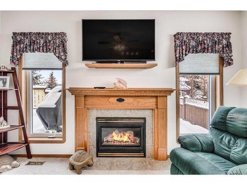 56 Willow Springs Crescent, Sylvan Lake, AB - Indoor Photo Showing Living Room With Fireplace