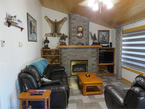 533 Raven Rise, Rural Clearwater County, AB - Indoor Photo Showing Living Room With Fireplace