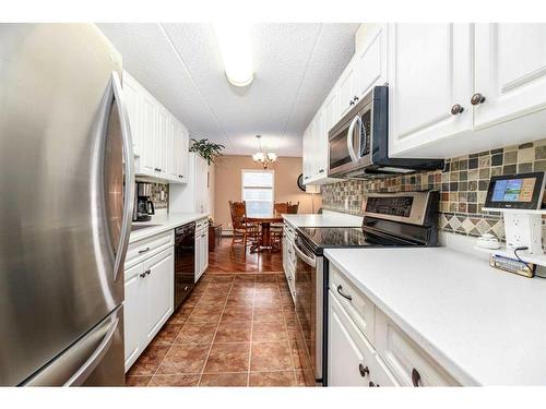 204-4522 47A Avenue, Red Deer, AB - Indoor Photo Showing Kitchen With Stainless Steel Kitchen