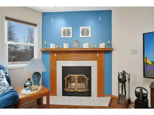 6011 67 Avenue, Rocky Mountain House, AB - Indoor Photo Showing Living Room With Fireplace