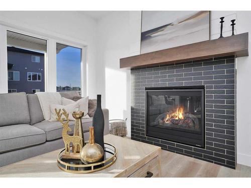 244 Emerald Drive, Red Deer, AB - Indoor Photo Showing Living Room With Fireplace
