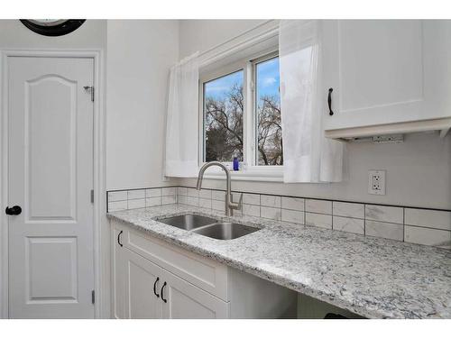 5027 52 Street, Rocky Mountain House, AB - Indoor Photo Showing Kitchen With Double Sink